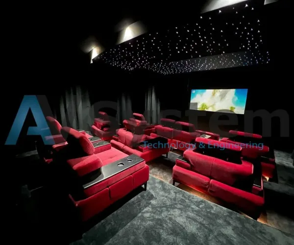 Salle de cinéma équipée par AV SYSTEM, avec écran géant et système de son surround pour une expérience audiovisuelle immersive.